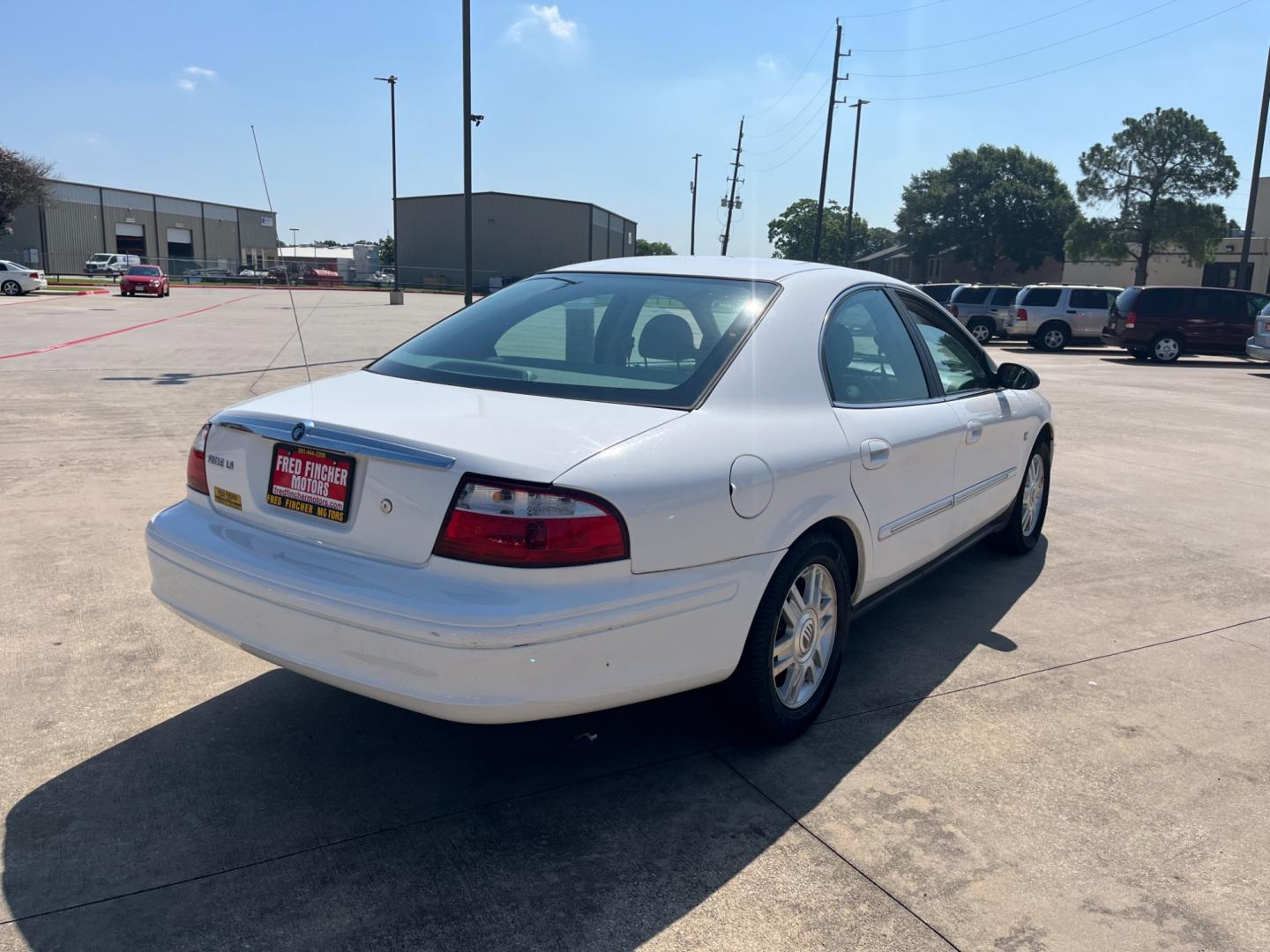 2004 white /TAN Mercury Sable LS Premium (1MEHM55S54A) with an 3.0L V6 SOHC 24V engine, 4-Speed Automatic Overdrive transmission, located at 14700 Tomball Parkway 249, Houston, TX, 77086, (281) 444-2200, 29.928619, -95.504074 - Photo#6